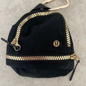 Lululemon Athletica Black and Gold Mini Bag / Air Pod Case